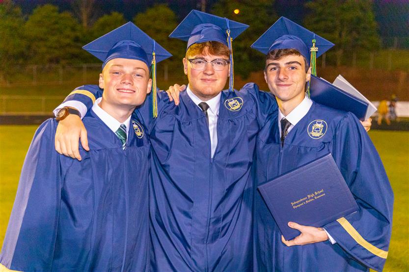 Students wearing blue graduation robes